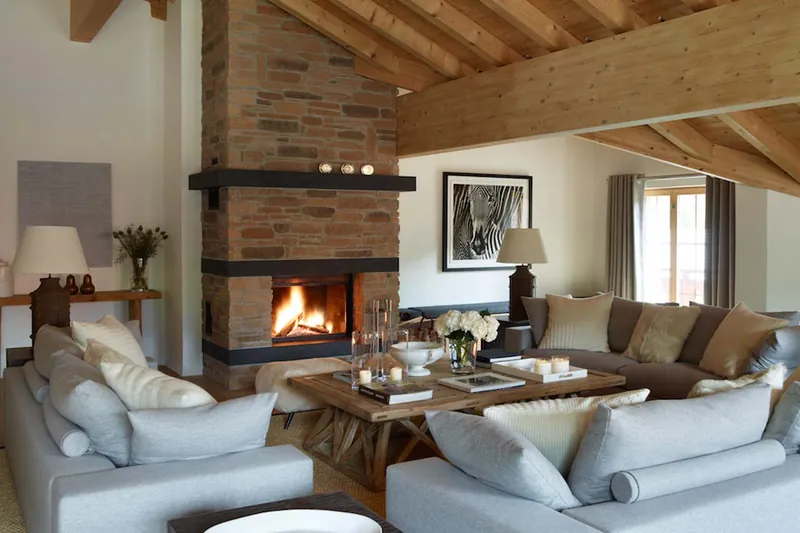 The lounge at Penthouse Emiko with a stone fireplace